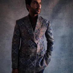 A closer look at the fully embroidered double-breasted suit by Anamika Khanna. The texture and pattern are incredible, making it a true couture menswear piece.
