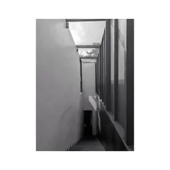 The staircase in our studio, where the simple geometry and play of light create a serene transition between floors.