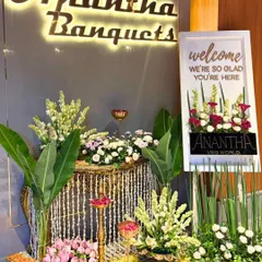 The elegant entrance decor we designed for Anantha Vegworld. We used a mix of traditional Indian flowers and brass elements to create a luxurious and welcoming ambiance.
