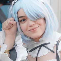 A close-up portrait of a cosplayer as Rem from Re:Zero, striking a cute pose. My goal is to create clean, character-focused portraits that cosplayers can be proud of.