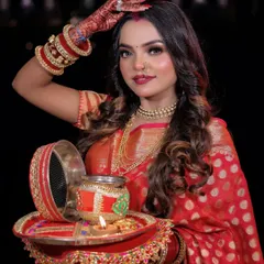 This image captures the essence of Karwa Chauth, with the model holding the decorative thali and sieve.