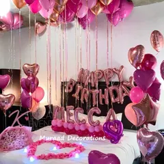 We can personalize your birthday surprise with a name and age, as seen in this vibrant pink and rose gold setup for Mecca's 4th birthday. The decor is complete with heart-shaped balloons and a heart made of lights.