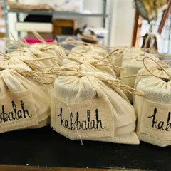 This is what a thoughtful corporate gift order looks like. Each of my full-sized body creams and polishers is packed in a reusable cloth bag with a handwritten tag, ready to make your team or clients feel truly appreciated.