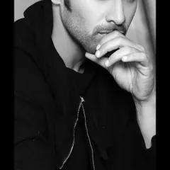 A classic black and white portrait of actor Pearl V Puri. This type of intense, expressive headshot is essential for an actor's portfolio, highlighting their screen presence without distraction.