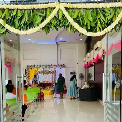 For a traditional housewarming ceremony, or griha pravesh, I designed this welcoming entrance. It uses auspicious elements like fresh mango leaf and marigold flower garlands to create a festive and culturally rich entryway.