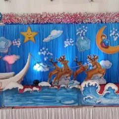 For a unique baby shower, I designed this whimsical night-sky theme. It features a crescent moon boat, stars, clouds, and even reindeer props for a magical feel.