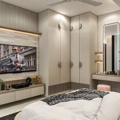 This bedroom unit is the ultimate space-saver. We designed it to include a full-size wardrobe, a TV console, and a dedicated dresser with a mirror and seating, ensuring every need is met within a single wall.