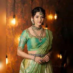 This is an example of my full-service ethnic styling for actress Samiksha. I coordinated this beautiful mint and gold lehenga with intricate traditional jewelry, complemented by flawless makeup and hair for a regal portrait.