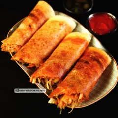 Crispy spring vegetable dosas, filled with a fresh mix of shredded vegetables and spices. This modern twist on the classic dosa is a popular choice at our live catering events, offering a light and crunchy option.