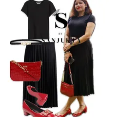 An all-black pleated skirt look is incredibly versatile. For this outfit, I've added a vibrant red bag and matching block heels to create a striking contrast that’s perfect for an evening out or a special event.