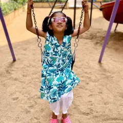 The pure joy of swinging high! I designed this 'Pakshi' (bird) print kurta to be versatile and fun. It's light enough for a warm day at the park and can be worn as a dress or paired with pants, making it a piece she'll reach for again and again.