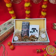A perfect blend of modern and traditional for Diwali. This hamper includes wireless earbuds and protein bars alongside classic dry fruits and decorative diyas, all in a beautifully designed box.