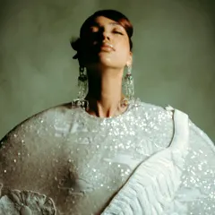 An expressive portrait for Rahul Mishra, capturing a serene moment with soft, diffused lighting that enhances the ethereal quality of the design.