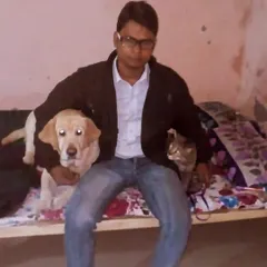 It's not just dogs! I have experience looking after cats too. Here I am with a Labrador puppy and a feline friend, both comfortable and safe in my home.
