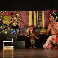We often blend traditional string puppetry with classical dance, a unique fusion that brings a dynamic energy to our storytelling. In this scene from "Malavikaagnimitram," a live dancer interacts with the puppets, creating a beautiful dialogue between two distinct art forms. This combination allows for a richer, multi-layered performance.