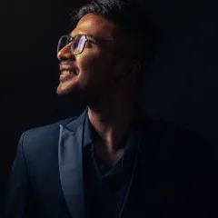 Another take on my artistic portrait. The light represents belief, and my smile reflects the joy I find in my craft.