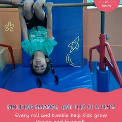 Building balance, one flip at a time. Hanging upside down on the bar is a fun way to get comfortable with inversions while strengthening arm and core muscles.