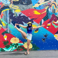 Yoga does not just happen on the mat. Finding a moment to stretch and play in front of a colorful mural is a reminder that this practice is about bringing flexibility and joy into all parts of life.