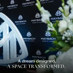 A dream designed, a space transformed. This shot captures the iconic Maybach logo against the custom-designed backdrop, with our floral work softening the edges. It shows how we blend brand elements seamlessly with our decor to create a cohesive visual story.