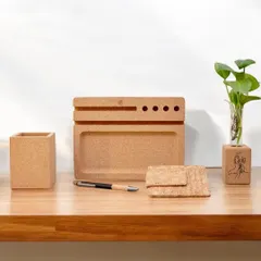 Organize your workspace sustainably with this cork desk set. It includes a pen stand, a tray, a card holder, and a planter, combining functionality with eco-friendly design.