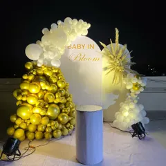 A full view of our elegant "Baby in Bloom" theme, showcasing the arrangement of gold and white balloons. This setup is perfect for a chic and memorable baby shower event, especially for evening celebrations where the lighting stands out.