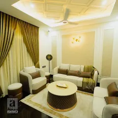 A luxurious living room where we provided custom-made, quilted sofas and elegant, heavy drapes. The rich brown and cream color palette creates a warm and opulent atmosphere.