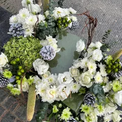 Elevating a luxury gift is all about the details. This arrangement for a Gucci box uses a cool palette of white and green, with hydrangeas, chrysanthemums, and eucalyptus creating a modern and sophisticated look for wedding trousseau packing.