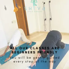 You do not need any prior experience to join my classes. This image shows students in Adho Mukha Svanasana, or Downward Facing Dog, a foundational yoga pose. I guide everyone gently, ensuring you learn the correct alignment to build a safe and strong practice from day one.