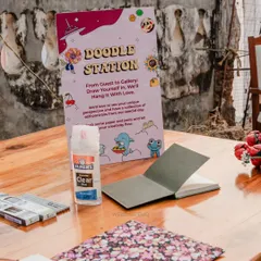 A 'Doodle Station' for guests to draw themselves and leave a message. We love creating unique activities that become cherished keepsakes for the couple.