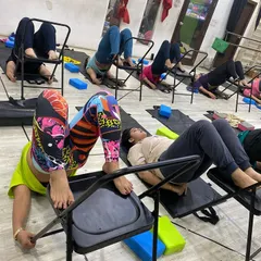 This supported inversion pose uses the chair to help students gently stretch their back and hamstrings while improving circulation.