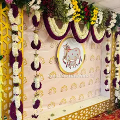Another angle of the cow-themed backdrop, showing the combination of a lotus-patterned wallpaper and a gold geometric frame. This blend of elements creates a rich and layered look.
