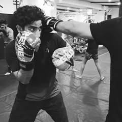 The eyes tell the whole story. This is the focus and intensity we build in every striking class. It's not just about throwing punches; it's about reading your opponent and staying sharp under pressure.