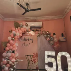 Another angle of the lovely 50th birthday decor. The setup fits perfectly within a home, making the celebration both grand and intimate.