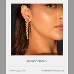Meet the Tornado Earring, where artistry blends with gravity. This gold droplet spirals down in a whirlwind of intricate design, crafted for those who dare to wear a unique statement.