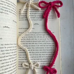 These coquette-style bow bookmarks are simple, elegant, and perfect for any book. I make them in a variety of colors, like the cream white and magenta ones shown here, each with a delicate bow at both ends.
