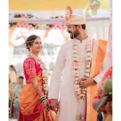 A classic Maharashtrian wedding moment, as the bride and groom share their first look as husband and wife.