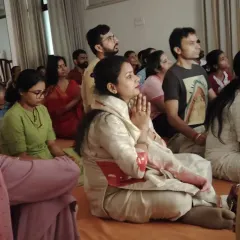 A seeker with hands in prayer during the Guru Purnima gathering. The space was filled with grace, love, and the palpable presence of the Guru and the Divine.
