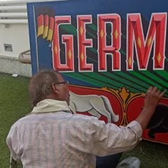 Another angle of me painting the "Germany in India" canvas outdoors at the event location.