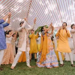 A candid moment from a Dandiya-themed Haldi carnival. The joy on everyone's faces as they dance with dandiya sticks is what makes these events so special.