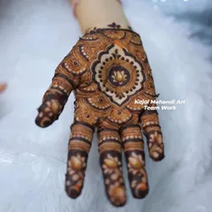 This lotus mandala design is a popular choice for party guests. It's elegant, centered, and looks beautiful on the back of the hand.