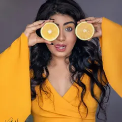 Doubling the fun with two orange slices for eyes. This is a playful and colorful shot that's all about not taking things too seriously and creating a portrait that makes you smile.