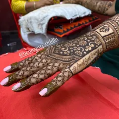 Your wedding hashtag is part of your story, so why not put it in your henna? I can seamlessly integrate your custom hashtag into the design, as seen here with "#AmolGotSwag".