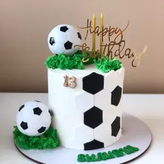 A cool soccer-themed cake with a hexagonal pattern, perfect for a football fan's birthday.