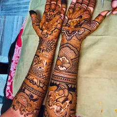 A full bridal design featuring a doli scene and intricate animal motifs like elephants and birds, in a classic Rajasthani style.
