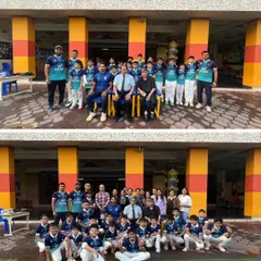 Our young cricketers and their parents posing for a group photo after the jersey distribution ceremony. We are a community dedicated to nurturing future champions.