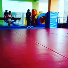 Advanced grade schoolers are seen here practicing their tumbling skills, demonstrating the progress children can make in our structured program.