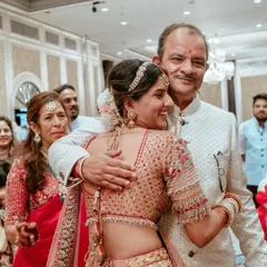 A father's hug holds a lifetime of love. This emotional moment between the bride and her father is a beautiful reminder of what weddings are all about.