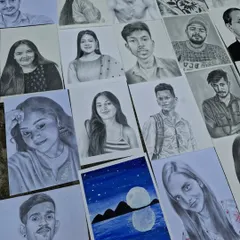 Another view of my recent creations laid out together. You can see the range of portraits, from individual headshots to more creative pieces.