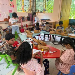 Our summer camps are always a blast! Here, a group of young innovators get serious with our 'Let's Build It' kits, learning through hands on making and collaboration.
