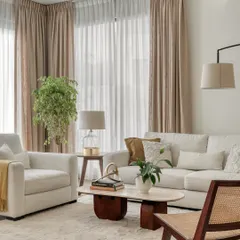 For our first villa project in Dubai, we created a light and airy living space perfect for a young family. The design uses a breathable palette of soft textiles, natural woods, and cane to create an expansive feel that is both functional and calming in the Dubai heat.